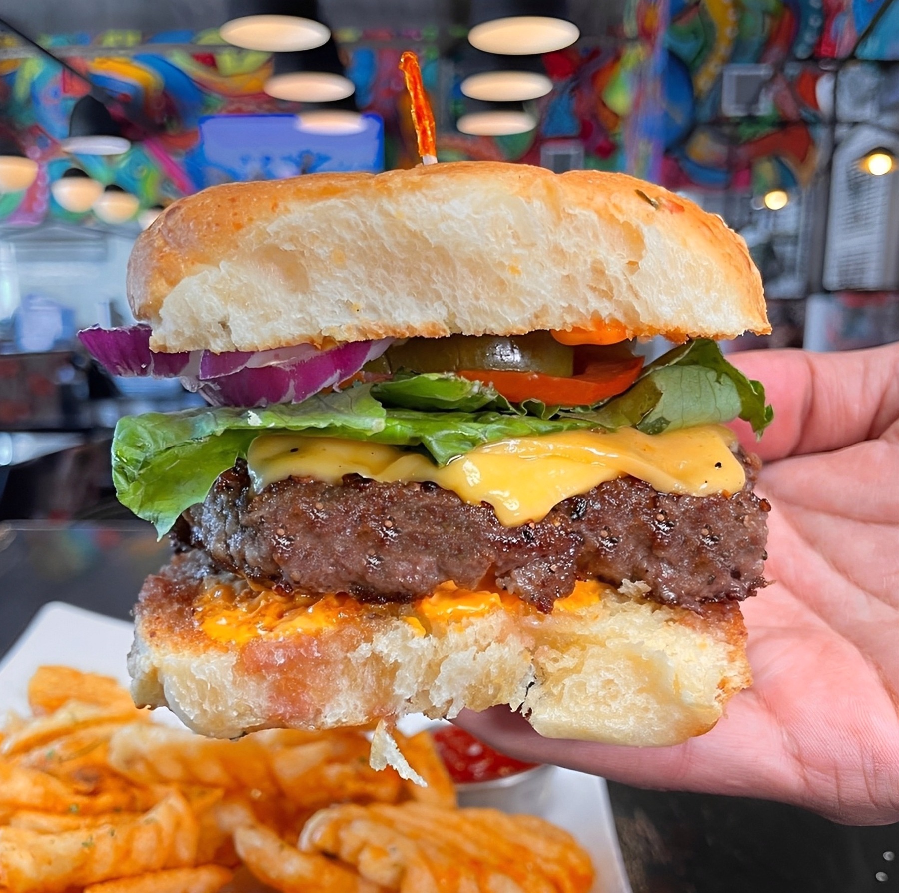 Gotti’s burger in the colorful dining room