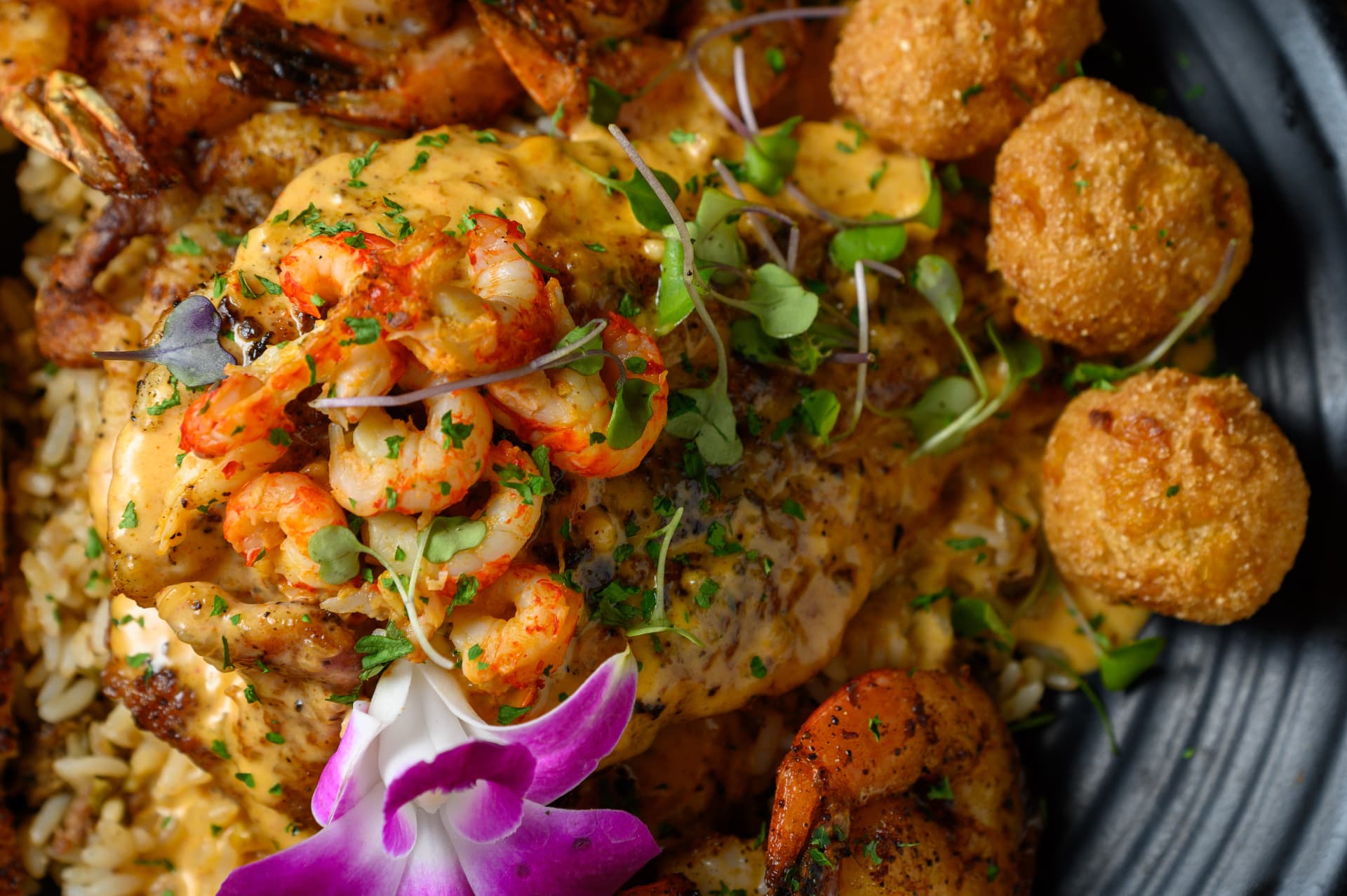 Blackened catfish, grilled shrimp, dirty rice and hushpuppies at Gotti’s
