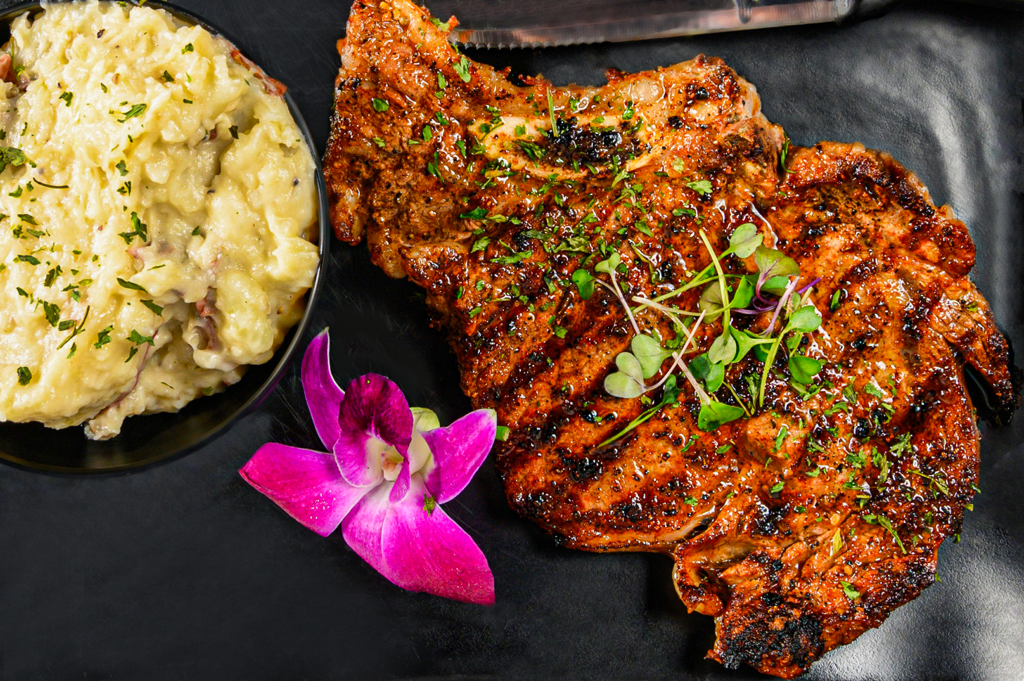 Gotti’s grilled ribeye steak with mashed potatoes